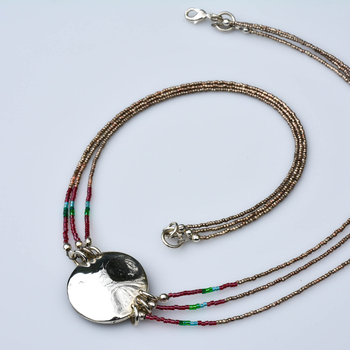 Three-Strand Tourmaline Necklace with Silver Medallion